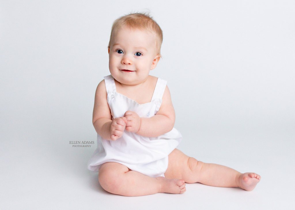 Baby boy 6 month pictures of a baby in white, by Ellen Adams Photography in Huntsville.