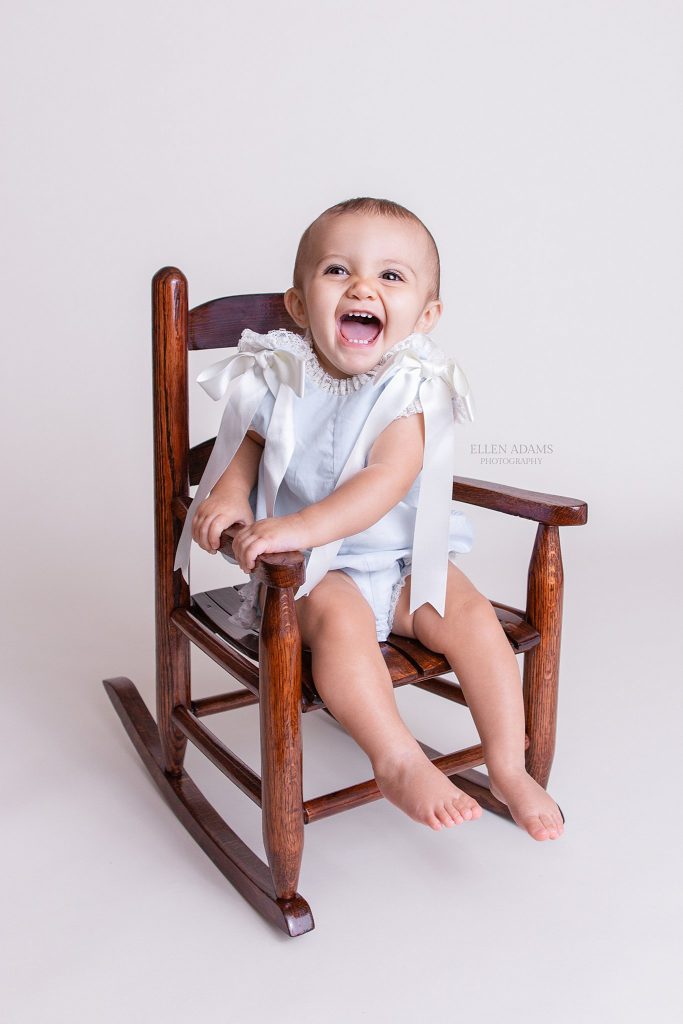 Hartselle baby photographer Ellen Adams Photography took this picture of a one year old baby in a rocking chair.