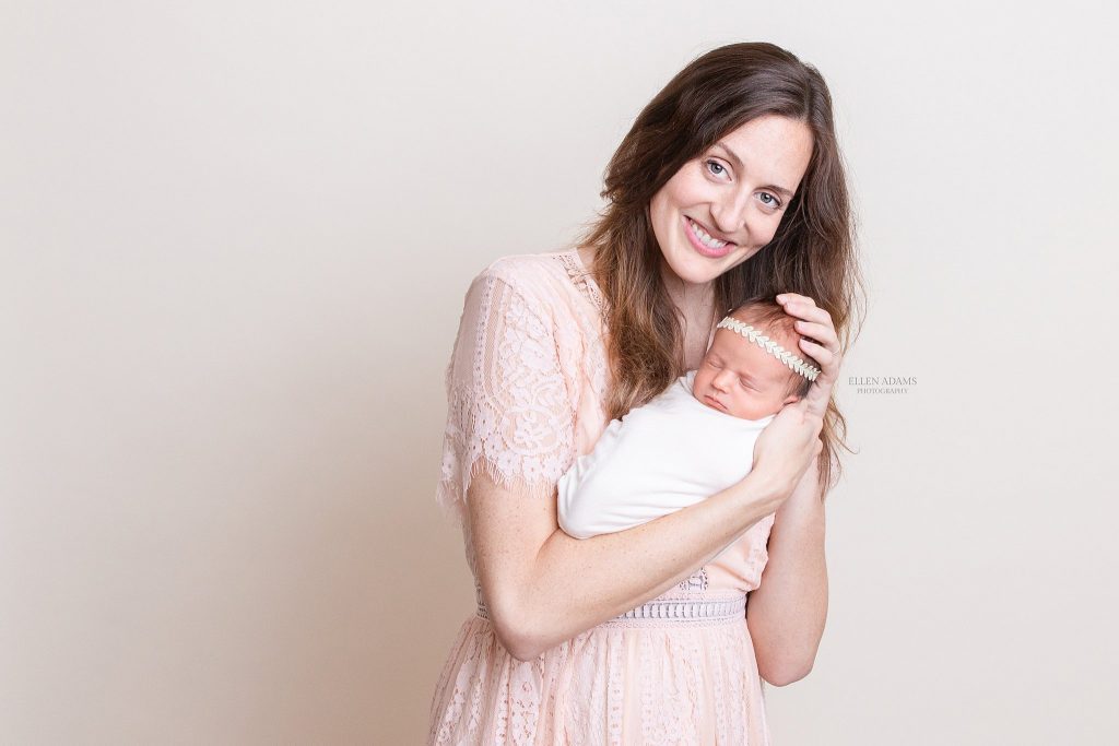 Mom holding baby, picture by Ellen Adams Photography.