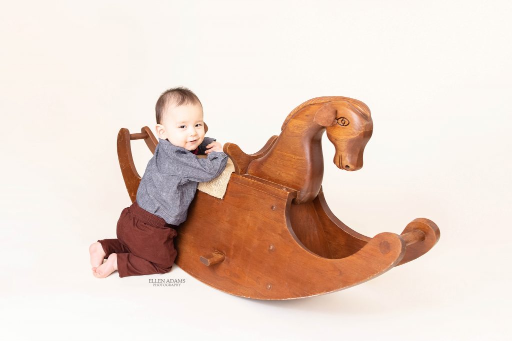 Baby Photoshoot image by Ellen Adams Photography of baby meeting his namesake's rocking horse.