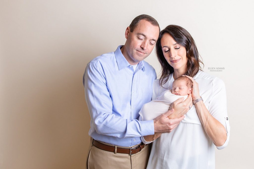 Mom and dad with baby during a newborn photography session with Ellen Adams Photography of Huntsville AL.